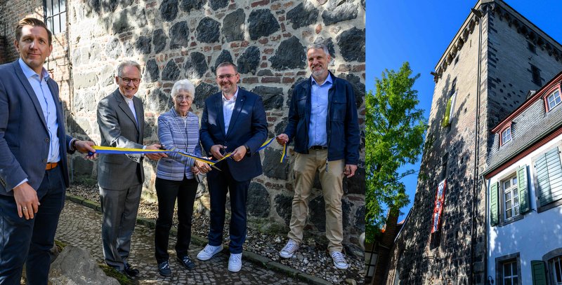 Thomas Schmitt (SWD), Pfarrer Dr. Heribert Lennartz, Ute Kienle, Bürgermeister Erik Lierenfeld und Denkmalschutzbeauftragter Harald Schlimgen vor dem Rheinturm